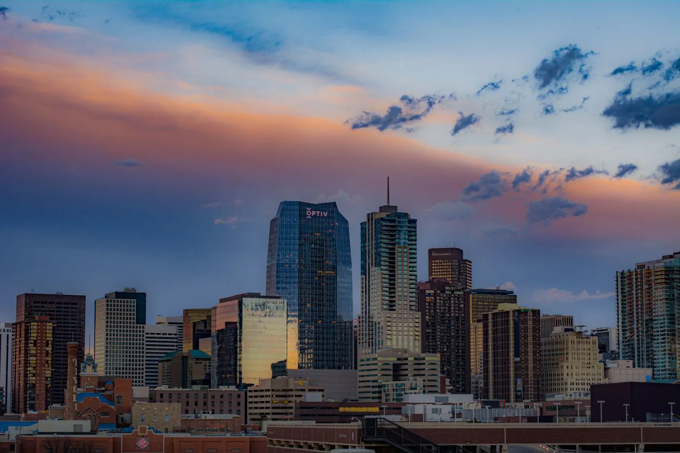 Downtown Denver skyline under a colorful sunset