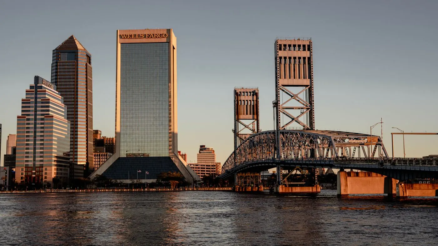 Jacksonville, Florida skyline and bridges over the St. Johns River at sunset