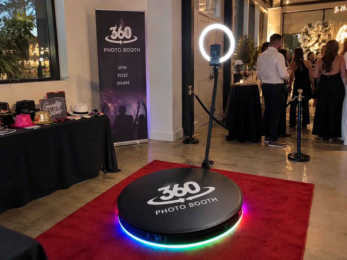 360 photo booth platform with a ring light at an evening event